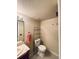Cozy bathroom with tile countertop, modern toilet and shelving unit at 7194 S Himalaya Way, Centennial, CO 80016