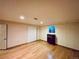 Spacious bedroom features hardwood flooring, a bright window, and closet space at 7194 S Himalaya Way, Centennial, CO 80016