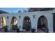 Charming courtyard featuring arched entryways, stucco walls, and decorative potted plants at 7194 S Himalaya Way, Centennial, CO 80016