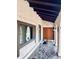Inviting entryway with decorative tiled floor, exposed wood beams, and double doors with a diamond design at 7194 S Himalaya Way, Centennial, CO 80016