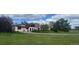 Inviting single-story home with arched entry and beautifully landscaped front yard at 7194 S Himalaya Way, Centennial, CO 80016