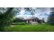 Exterior with grass, trees and driveway at 7194 S Himalaya Way, Centennial, CO 80016
