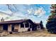 Single Gathering home featuring stucco siding, clay tile roof, and a well-manicured backyard at 7194 S Himalaya Way, Centennial, CO 80016