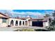 Charming stucco home with a red tile roof, arched entryway, and a well-manicured front yard at 7194 S Himalaya Way, Centennial, CO 80016