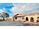 Charming front yard with adobe-style arched fencing, well-maintained landscaping, and seating area at 7194 S Himalaya Way, Centennial, CO 80016