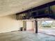 Spacious three-car garage with overhead storage and an automatic door with outside view at 7194 S Himalaya Way, Centennial, CO 80016