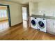 Well lit Laundry Room with updated Washer and Dryer set and folding area at 7194 S Himalaya Way, Centennial, CO 80016