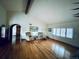 Bright living room with hardwood floors, large windows, vaulted ceilings, and comfortable seating at 7194 S Himalaya Way, Centennial, CO 80016
