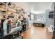 Finished basement with bedroom, shelving, and wood floors at 12460 S Hollow Creek Ct, Parker, CO 80134