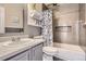 Clean bathroom with shower/tub combo and updated vanity at 12460 S Hollow Creek Ct, Parker, CO 80134