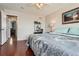 Main bedroom with en-suite bathroom and hardwood floors at 12460 S Hollow Creek Ct, Parker, CO 80134