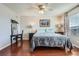 Main bedroom with hardwood floors and ceiling fan at 12460 S Hollow Creek Ct, Parker, CO 80134