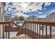 Deck overlooking backyard and community in winter at 12460 S Hollow Creek Ct, Parker, CO 80134