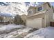 Two-story house with driveway and snow on the ground at 12460 S Hollow Creek Ct, Parker, CO 80134