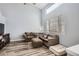 Living room with two sofas, ottoman, and wood-look floors at 12460 S Hollow Creek Ct, Parker, CO 80134