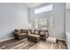 Living room with two sofas, ottoman, and wood-look floors at 12460 S Hollow Creek Ct, Parker, CO 80134