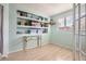 Bright office with built-in shelving and hardwood floors at 12460 S Hollow Creek Ct, Parker, CO 80134