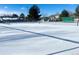Outdoor tennis court covered in snow at 12460 S Hollow Creek Ct, Parker, CO 80134