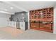 Finished basement featuring stylish bar with wine storage and cooler at 3049 S Vine St, Denver, CO 80210