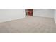 Spacious basement area featuring carpeted floor, white walls, and a built-in wine rack at 3049 S Vine St, Denver, CO 80210