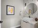 Modern powder room featuring geometric wallpaper, updated vanity, and vessel sink at 3049 S Vine St, Denver, CO 80210