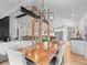 Elegant dining room with modern lighting, hardwood floors, and an open floor plan at 3049 S Vine St, Denver, CO 80210