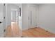 Welcoming entryway with modern door and hardwood floors at 3049 S Vine St, Denver, CO 80210