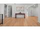 Stylish entryway with hardwood floors, a console table, and modern artwork at 3049 S Vine St, Denver, CO 80210