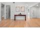Inviting entryway with light hardwood floors, clean lines, and minimalist decor at 3049 S Vine St, Denver, CO 80210