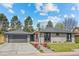 Charming exterior with a well-manicured lawn, mature trees, and a welcoming entrance at 3049 S Vine St, Denver, CO 80210