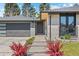Charming front exterior with modern design elements, landscaping, and a well-maintained yard at 3049 S Vine St, Denver, CO 80210