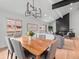 Open living room features a vaulted ceiling, modern fireplace and stylish furnishings at 3049 S Vine St, Denver, CO 80210