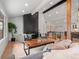 Stylish living room with a modern fireplace, comfortable seating, and open concept design at 3049 S Vine St, Denver, CO 80210