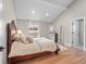 Cozy main bedroom features hardwood floors, beamed ceilings, and ample natural light at 3049 S Vine St, Denver, CO 80210