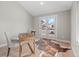 Bright office space with french doors, wood floors and area rug at 3049 S Vine St, Denver, CO 80210