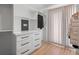 Organized walk-in closet with custom shelving, drawers and hanging storage at 3049 S Vine St, Denver, CO 80210