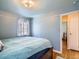 Bright bedroom with ensuite access and wood floors at 7845 W 9Th Ave, Lakewood, CO 80214