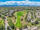 Beautiful aerial view overlooking the golf course and neighborhood with mountain views in the distance at 13895 Sandtrap Cir, Broomfield, CO 80023