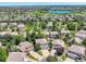 Aerial view of homes in a neighborhood with a lake and golf course in the distance at 13895 Sandtrap Cir, Broomfield, CO 80023