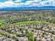 Scenic aerial view of a well-maintained golf course community on a sunny day at 13895 Sandtrap Cir, Broomfield, CO 80023