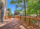 Wooden backyard deck under mature shade trees at 13895 Sandtrap Cir, Broomfield, CO 80023