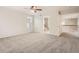 Spacious carpeted bedroom with a ceiling fan and a doorway to an ensuite bathroom at 13895 Sandtrap Cir, Broomfield, CO 80023