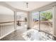 The dining area boasts wood floors, sliding glass doors to a deck, and views of the backyard and common areas at 13895 Sandtrap Cir, Broomfield, CO 80023
