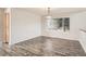 Open dining room featuring wood floors and large window with natural light at 13895 Sandtrap Cir, Broomfield, CO 80023