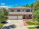 Charming two-story home featuring a well-maintained lawn, a two-car garage, and a cozy front porch at 13895 Sandtrap Cir, Broomfield, CO 80023