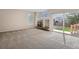 The living room includes a fireplace and has sliding glass door access to the backyard at 13895 Sandtrap Cir, Broomfield, CO 80023