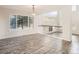 Open living room featuring wood floors and an overlook to a fireplace at 13895 Sandtrap Cir, Broomfield, CO 80023