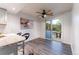 Dining area with sliding glass doors to an outdoor patio, next to kitchen with bar seating at 15491 E Wyoming Dr # A, Aurora, CO 80017