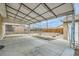 Open patio area with metal awning, perfect for outdoor entertaining and relaxing at 283 Garland Dr, Northglenn, CO 80233