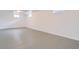 Spacious unfinished basement featuring painted floors, recessed lighting and multiple windows at 283 Garland Dr, Northglenn, CO 80233